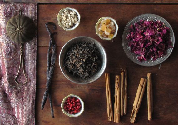Vanilla bean, rose petals, cinnamon sticks and spices representing the different tastes of an ayurvedic diet. 